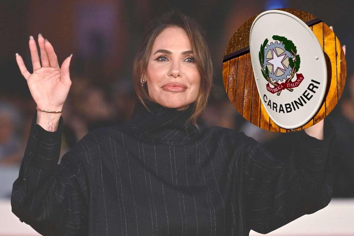 ilary blasi a mani alzate e i carabinieri
